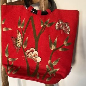 Red embroidered Anthropologie lacquer ring purse